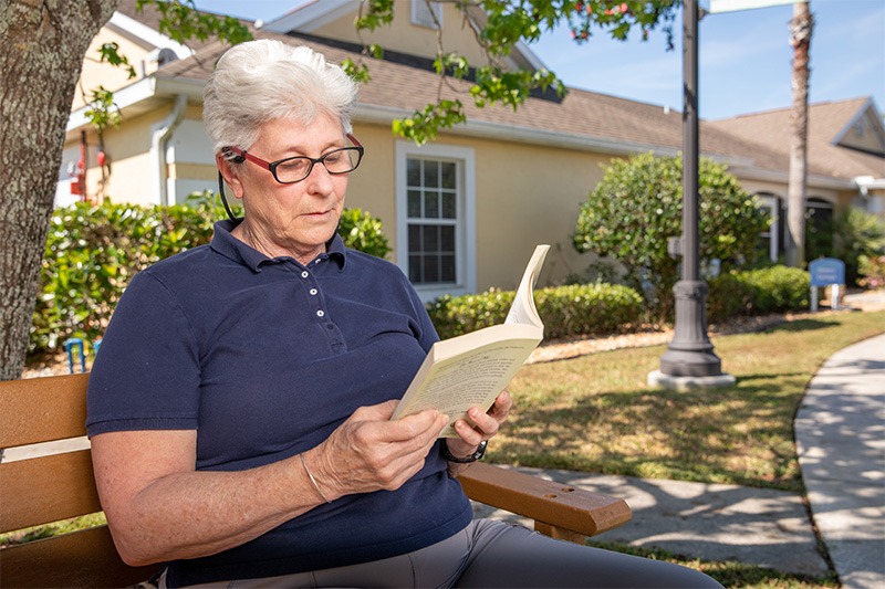 resident reading outside