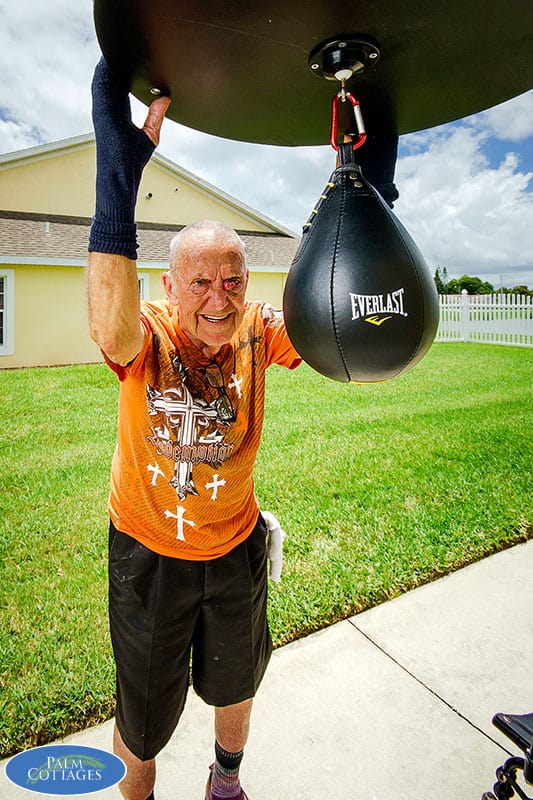 elderly man enjoying amenity at assisted living facility